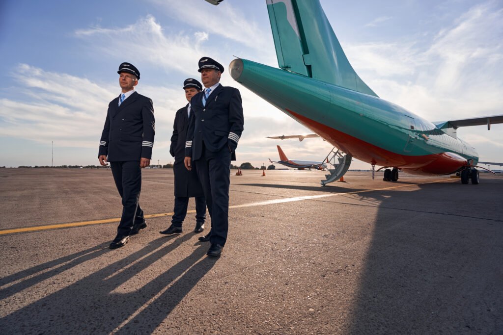 Luxury Airport Service 13 tree pilots standing near plane rear part 2025 03 08 20 42 46 utc